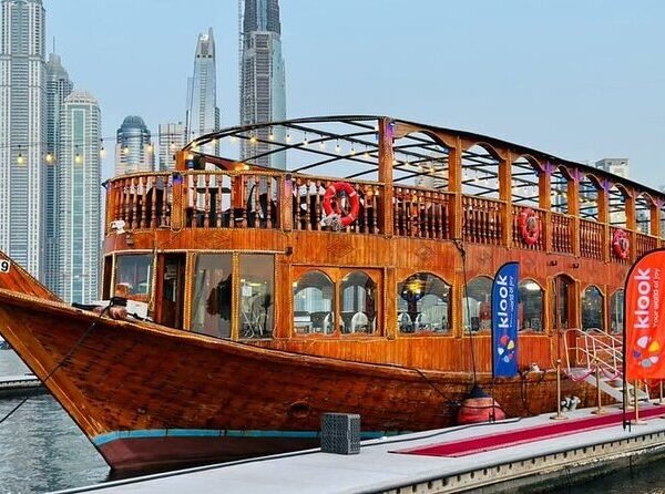 Luxury dhow cruise with glowing lights sailing through Dubai Marina at night 3
